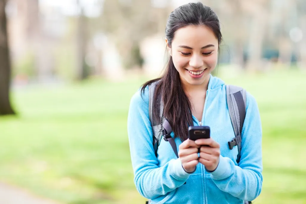 Student practicing a DMV written test on a phone